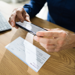 Man scanning a check with his smartphone