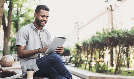 man reading on his tablet.