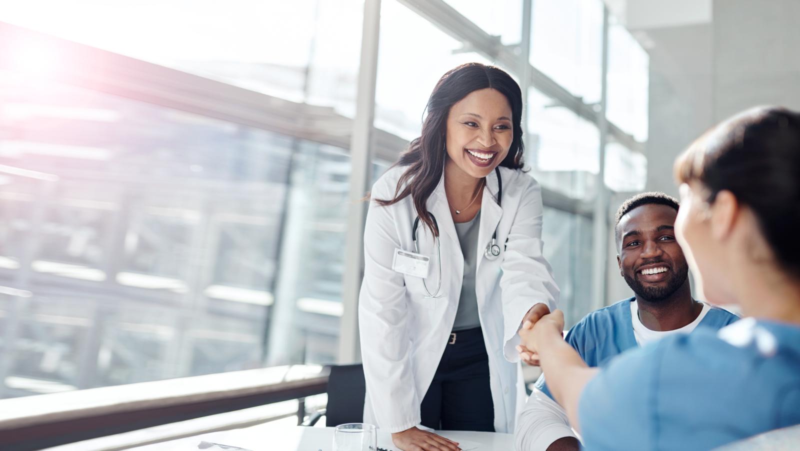 female doctor shaking hands